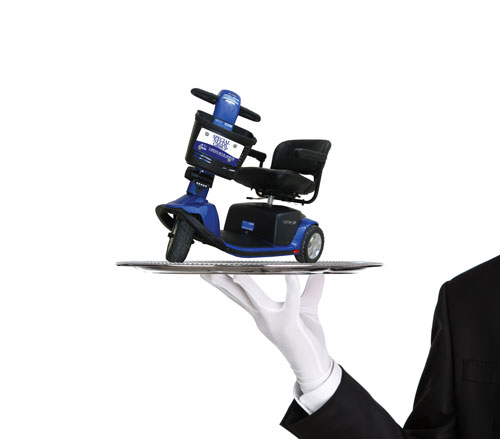Special Needs Group White Glove Service Logo with Scooter on a Silver Plate being held up by a White Glove